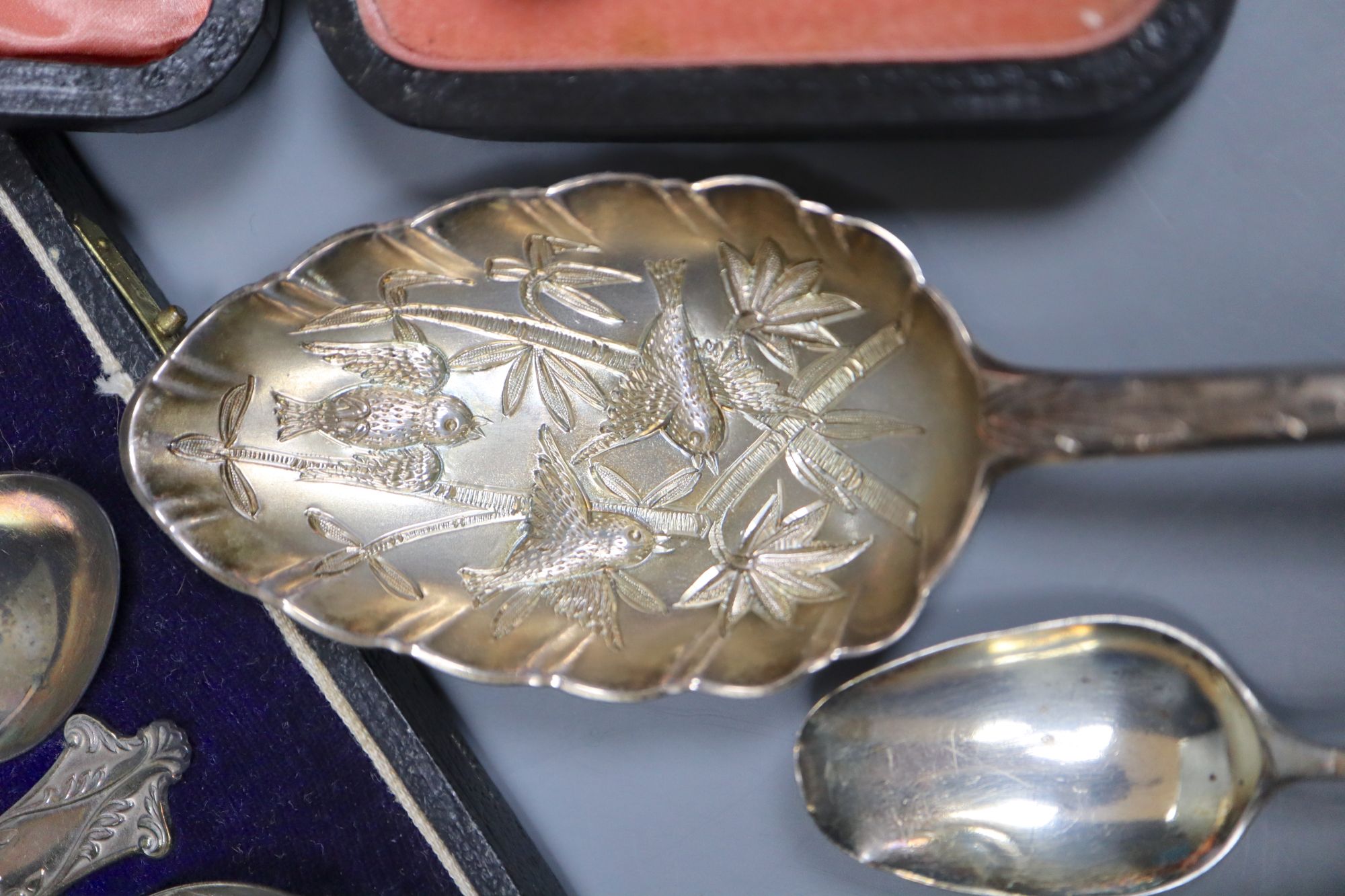 Small silver - 2 berry spoons, butter knife, ladle, feeder, christening spoon and fork. Two cased sets, tongs and a silver gilt spoon